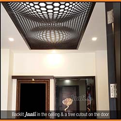 An illusion designed 2D backlit Jaali in the ceiling (18mm thick MDF) & a tree cut on the door copy.jpg